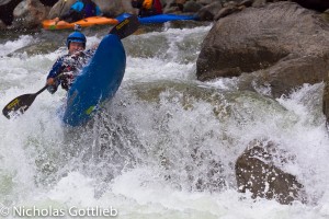 Christian Polar hits the elusive boof towards the top of the Oyocachi. Note the patches on the bottom of his boat -- unbroken kayaks are hard to come by in Ecuador.